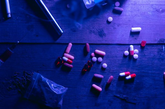 Opioid overdose - pills spread out on a table
